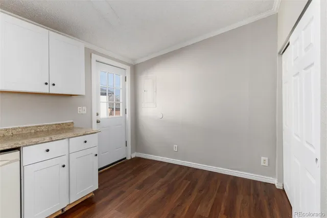 a view of cabinets and wooden floor
