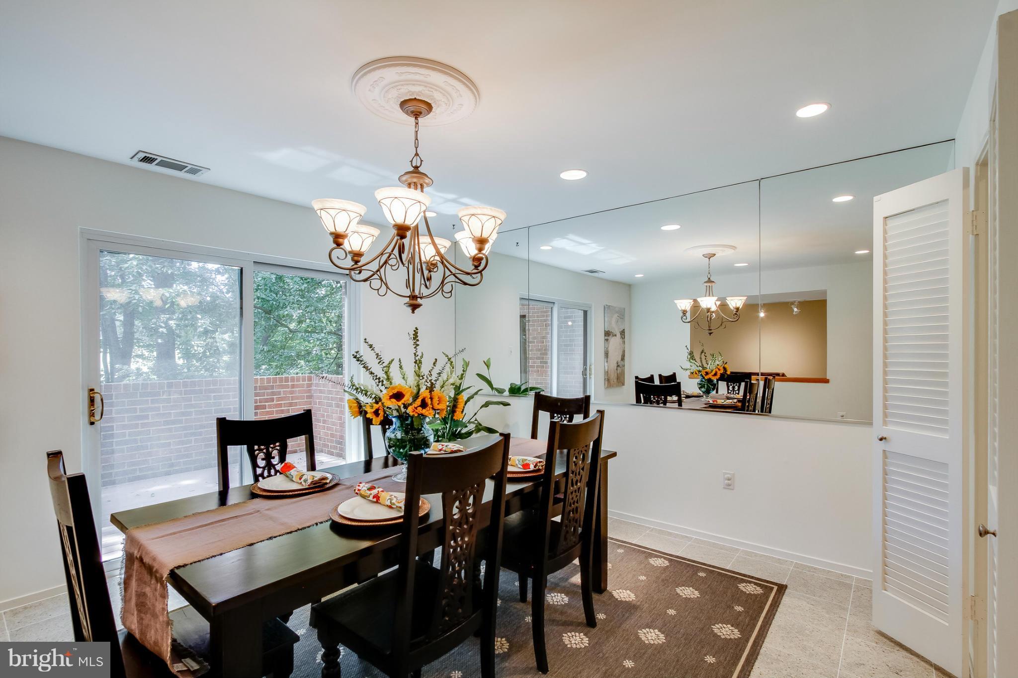 11729 Indian Ridge Road Reston, VA 20191 - Photo 11 of 30 a view of a dining room and chandelier furniture and a chandelier