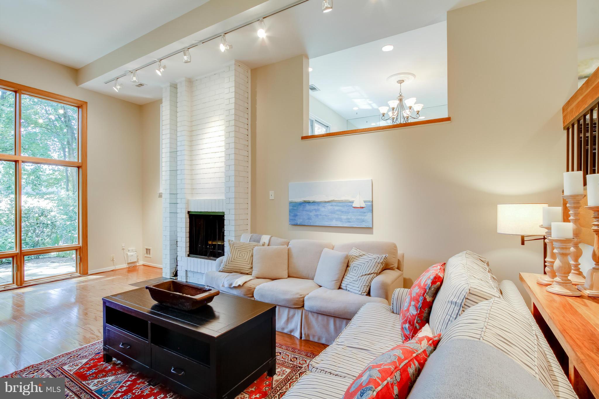 11729 Indian Ridge Road Reston, VA 20191 - Photo 14 of 30 a living room with furniture and a fireplace