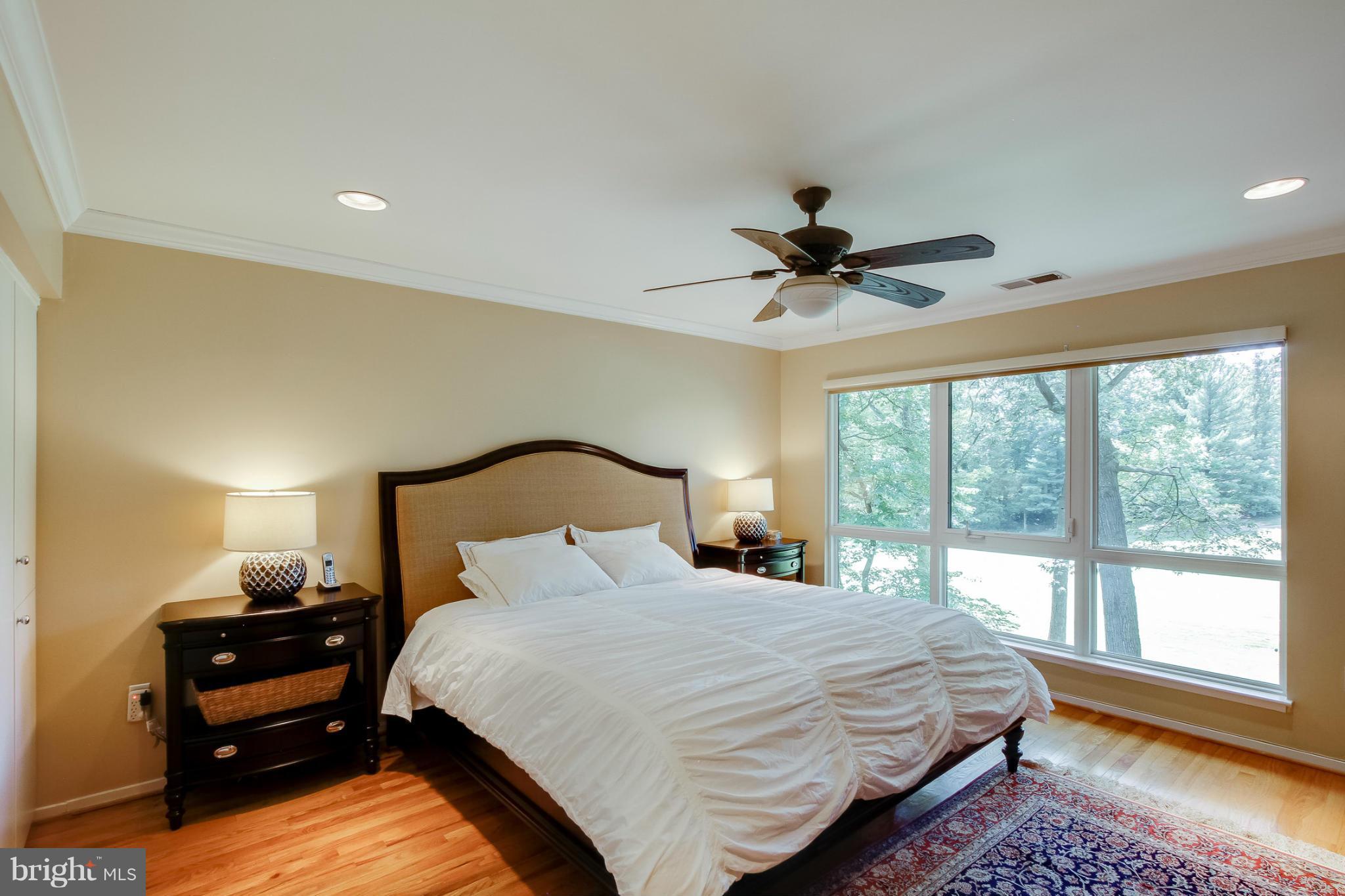 11729 Indian Ridge Road Reston, VA 20191 - Photo 17 of 30 a bedroom with a bed and a large window