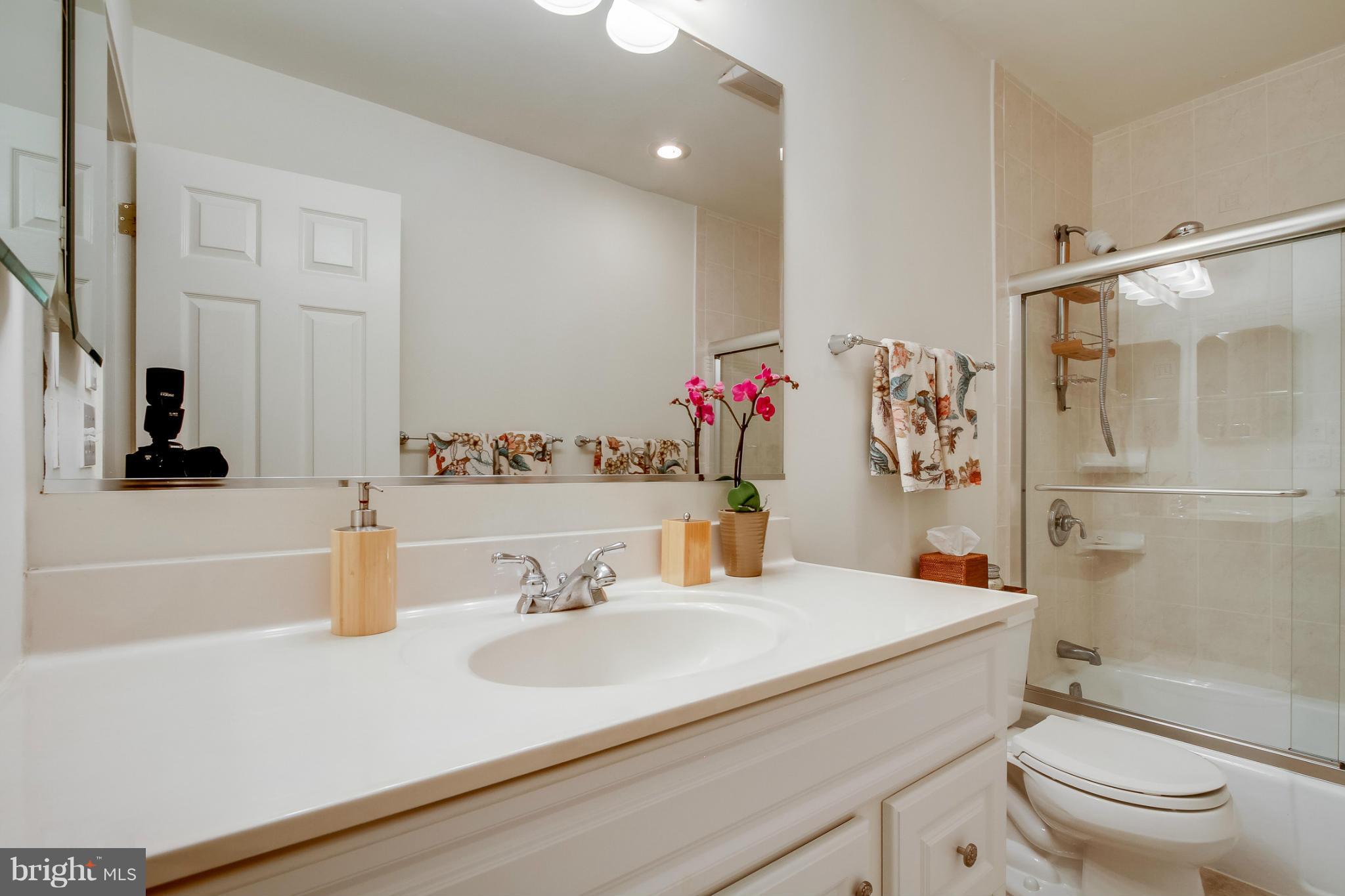 11729 Indian Ridge Road Reston, VA 20191 - Photo 19 of 30 a bathroom with a sink toilet vanity and shower