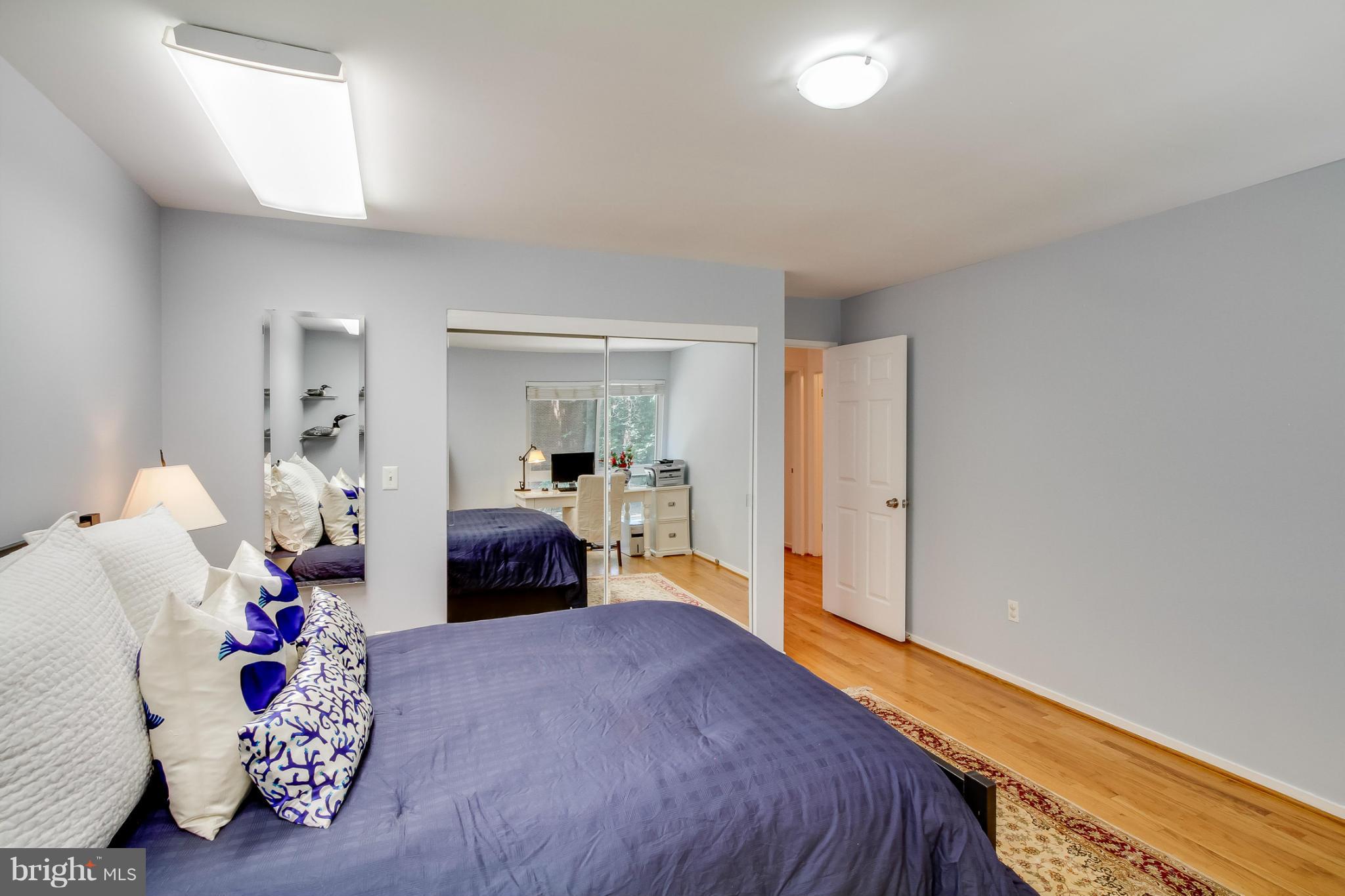 11729 Indian Ridge Road Reston, VA 20191 - Photo 20 of 30 a bedroom with a bed and a couch