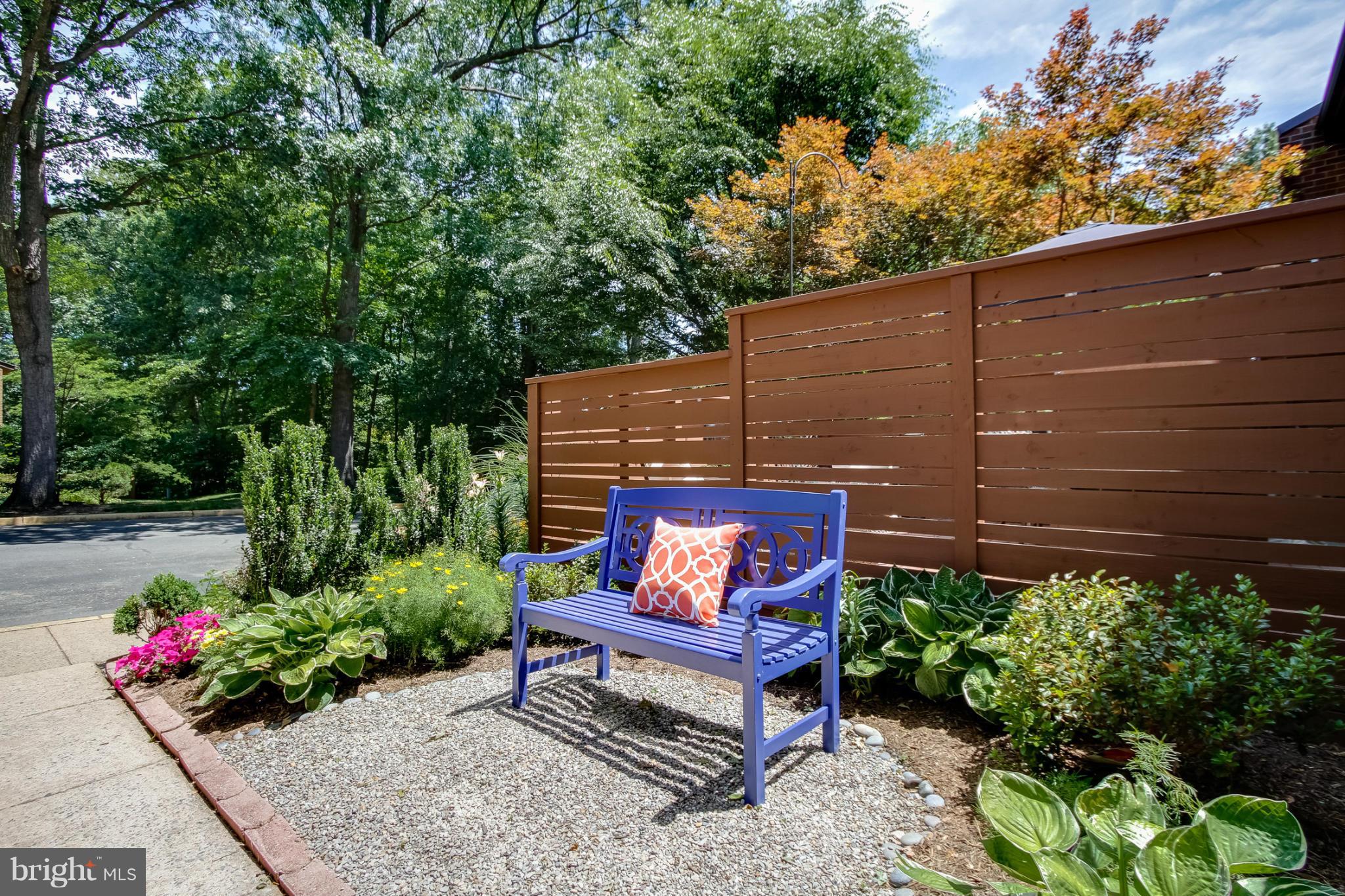 11729 Indian Ridge Road Reston, VA 20191 - Photo 3 of 30 a view of a bench in the garden