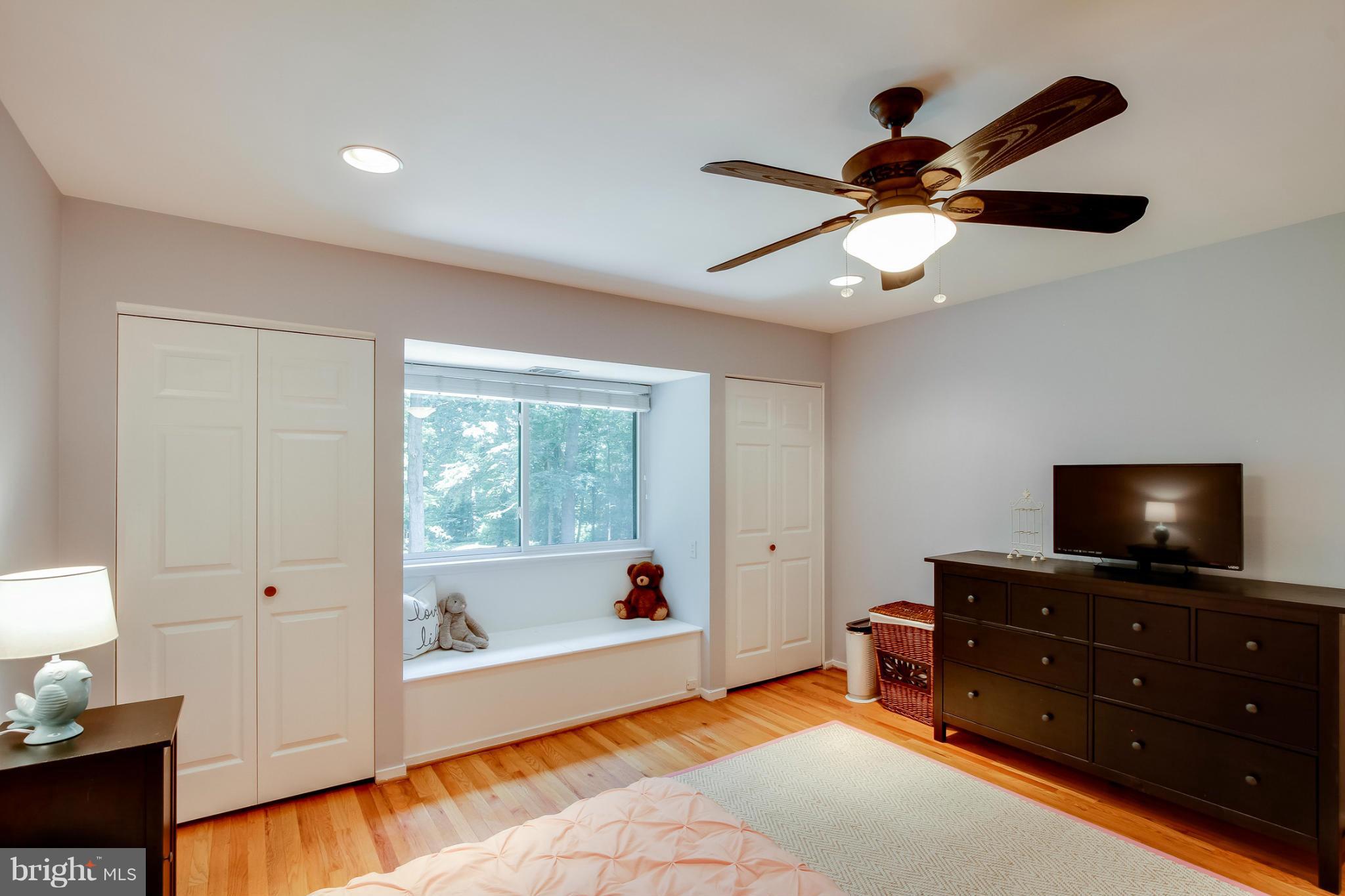 11729 Indian Ridge Road Reston, VA 20191 - Photo 24 of 30 a living room with furniture and a flat screen tv
