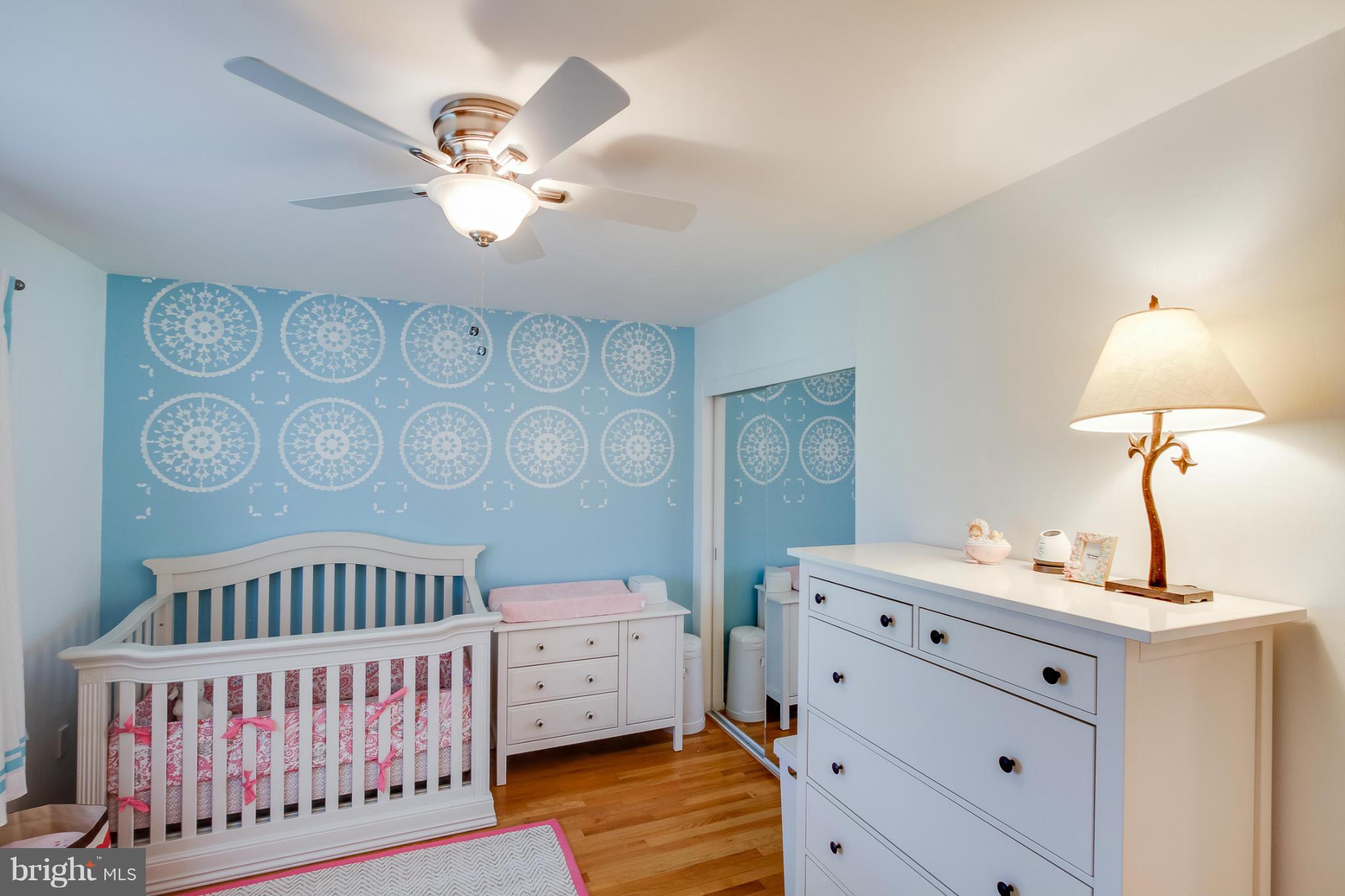 11729 Indian Ridge Road Reston, VA 20191 - Photo 25 of 30 a bedroom with a bed and a table
