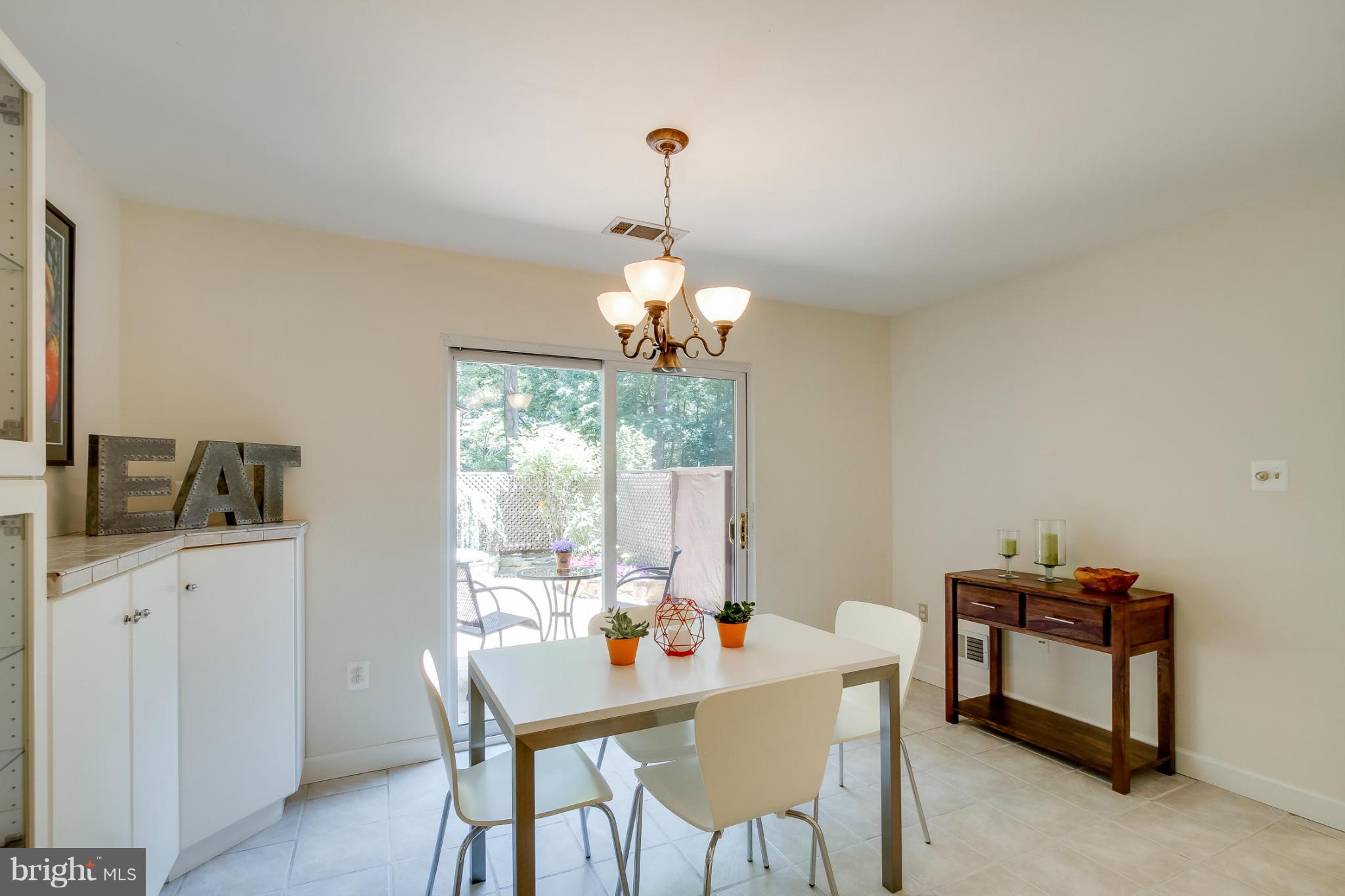 11729 Indian Ridge Road Reston, VA 20191 - Photo 9 of 30 a dining room with furniture and window
