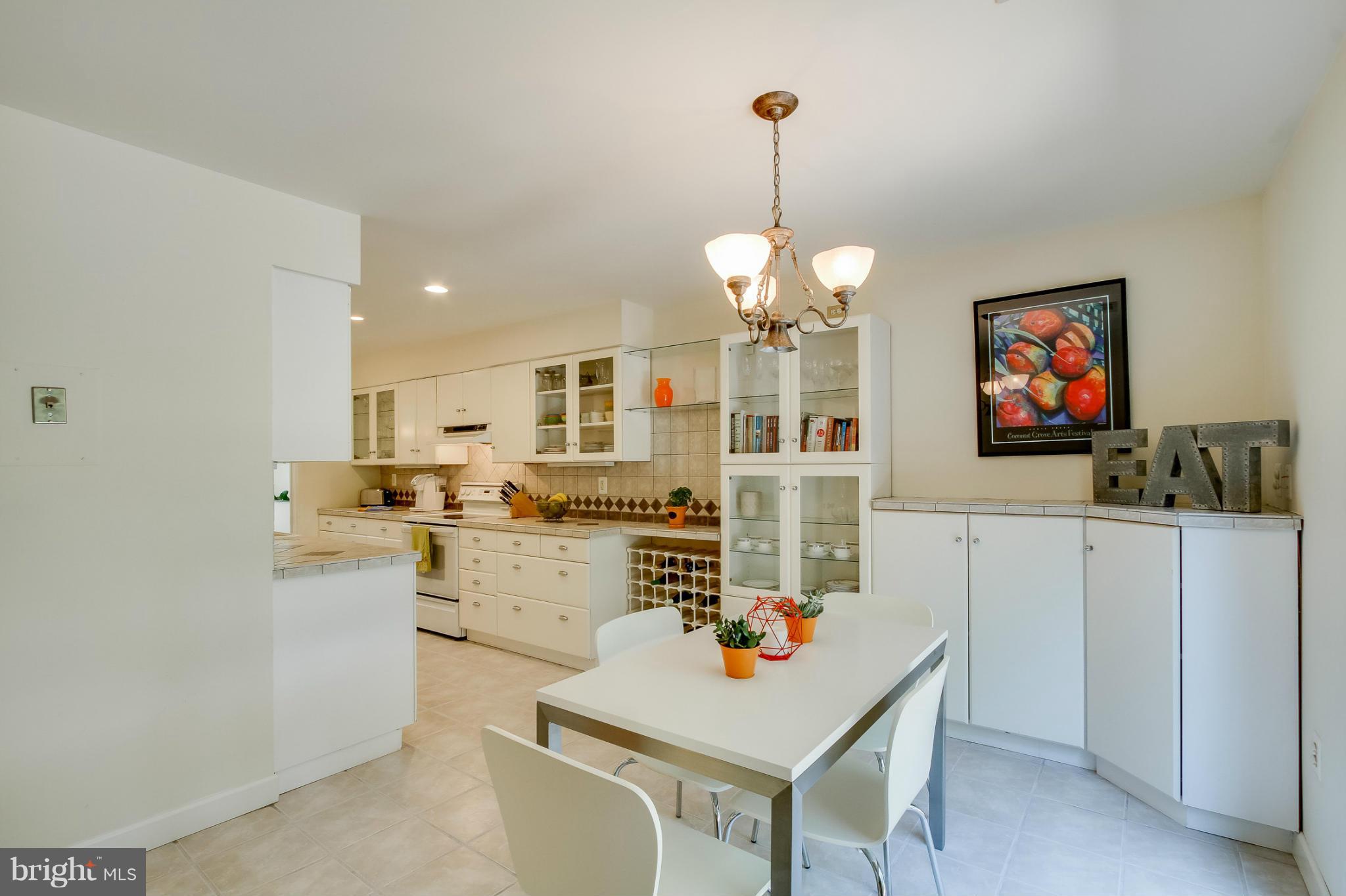 11729 Indian Ridge Road Reston, VA 20191 - Photo 10 of 30 a living room with stainless steel appliances furniture a chandelier and a kitchen view