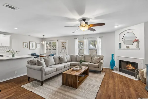 a living room with furniture and a fireplace