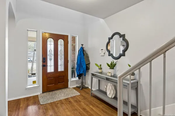a view of an entryway with wooden floor