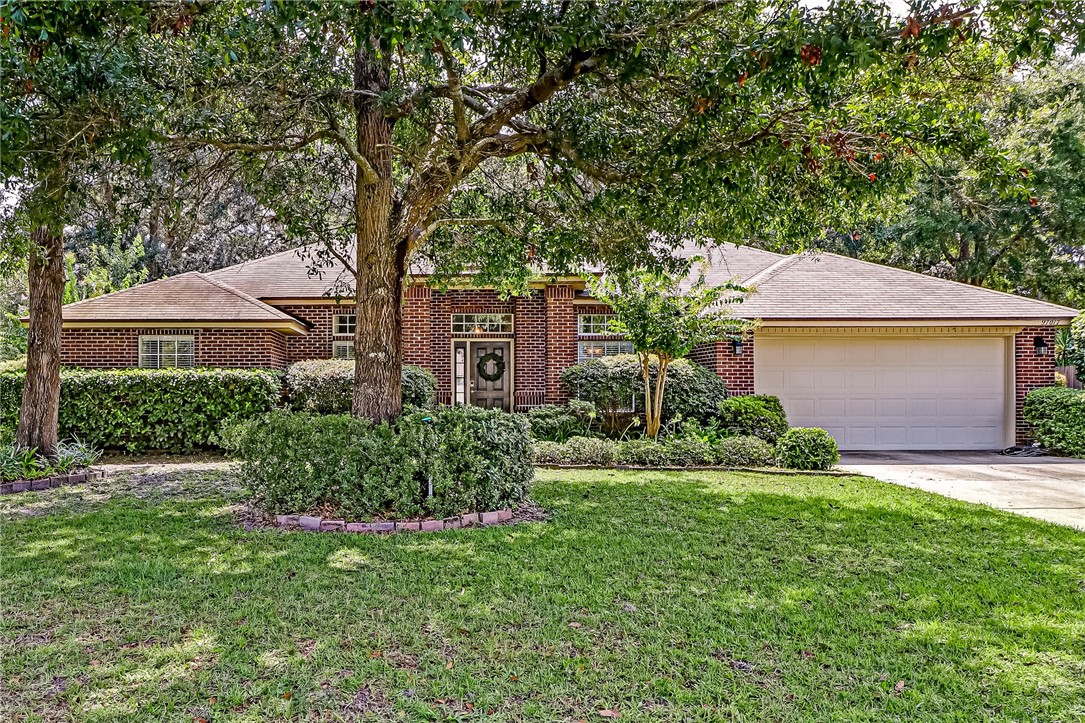97017 Castle Ridge Drive Yulee, FL 32097 - Photo 1 of 31 a front view of a house with a yard and garage