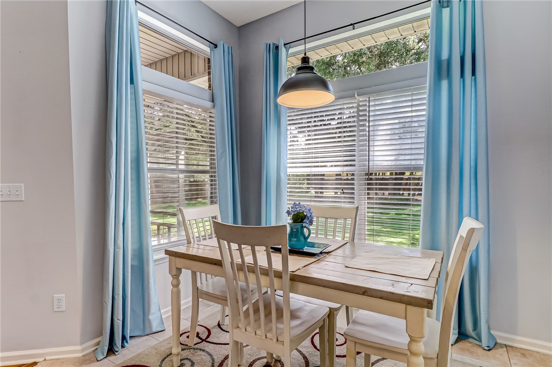 97017 Castle Ridge Drive Yulee, FL 32097 - Photo 8 of 31 a dining room with furniture and window