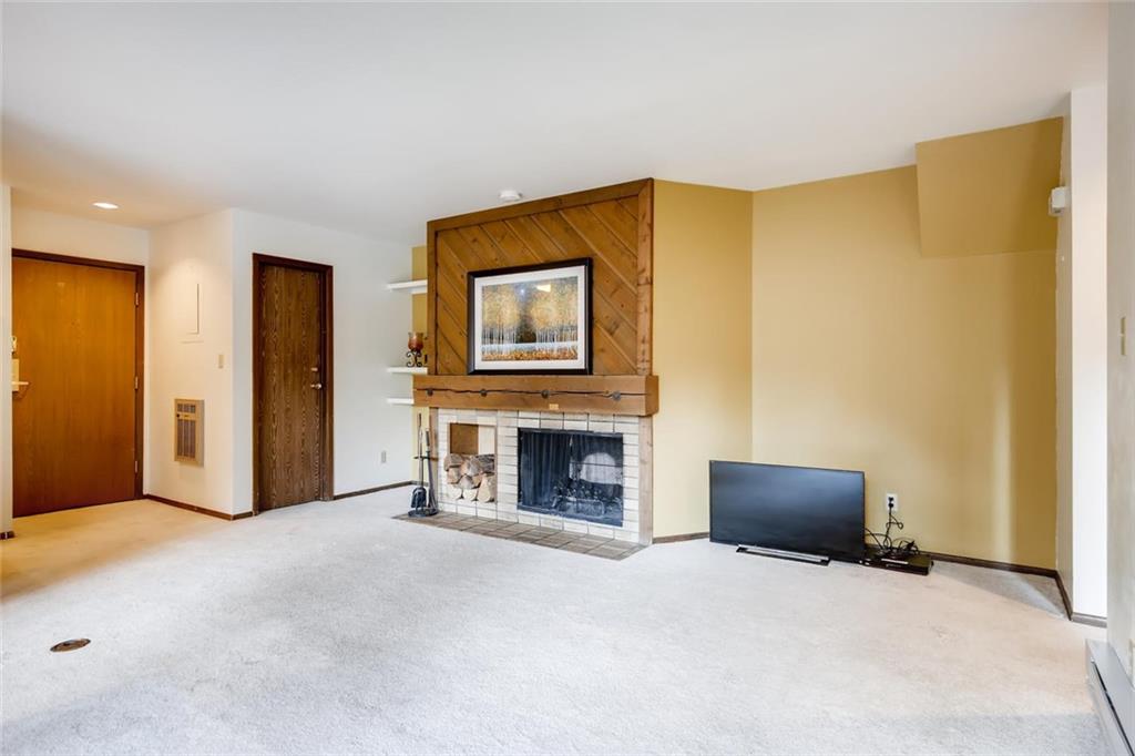 1977 Soda Ridge Road, Unit 1190 Keystone, CO 80435 - Photo 22 of 34 a view of a livingroom with a fireplace