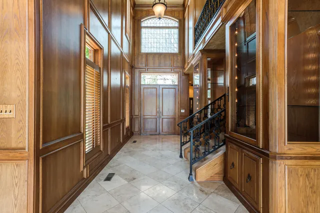 a view of entryway and hall with a door