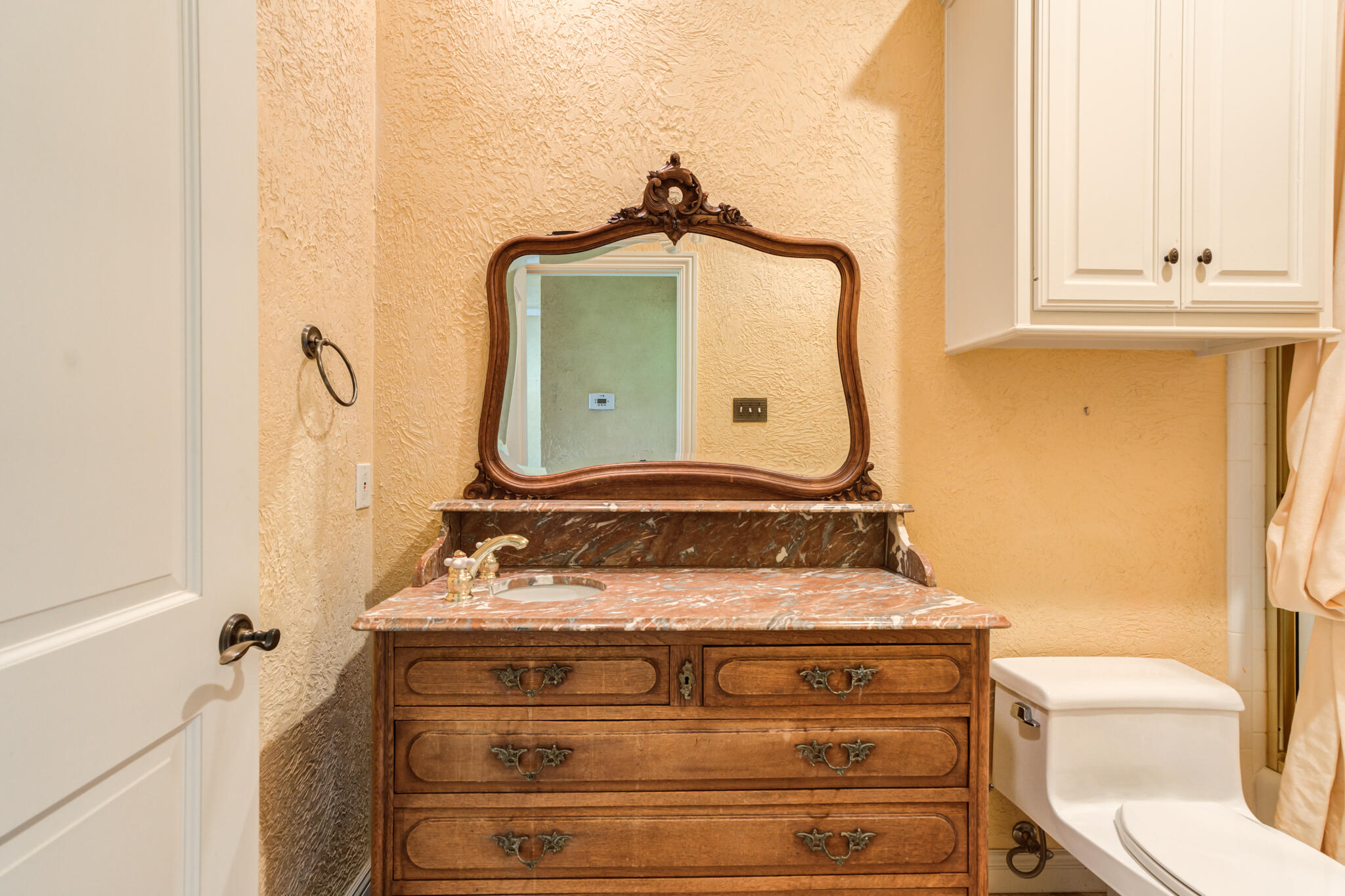 8901 York Place Lubbock, TX 79424 - Photo 36 of 45 a bathroom with a sink and a mirror