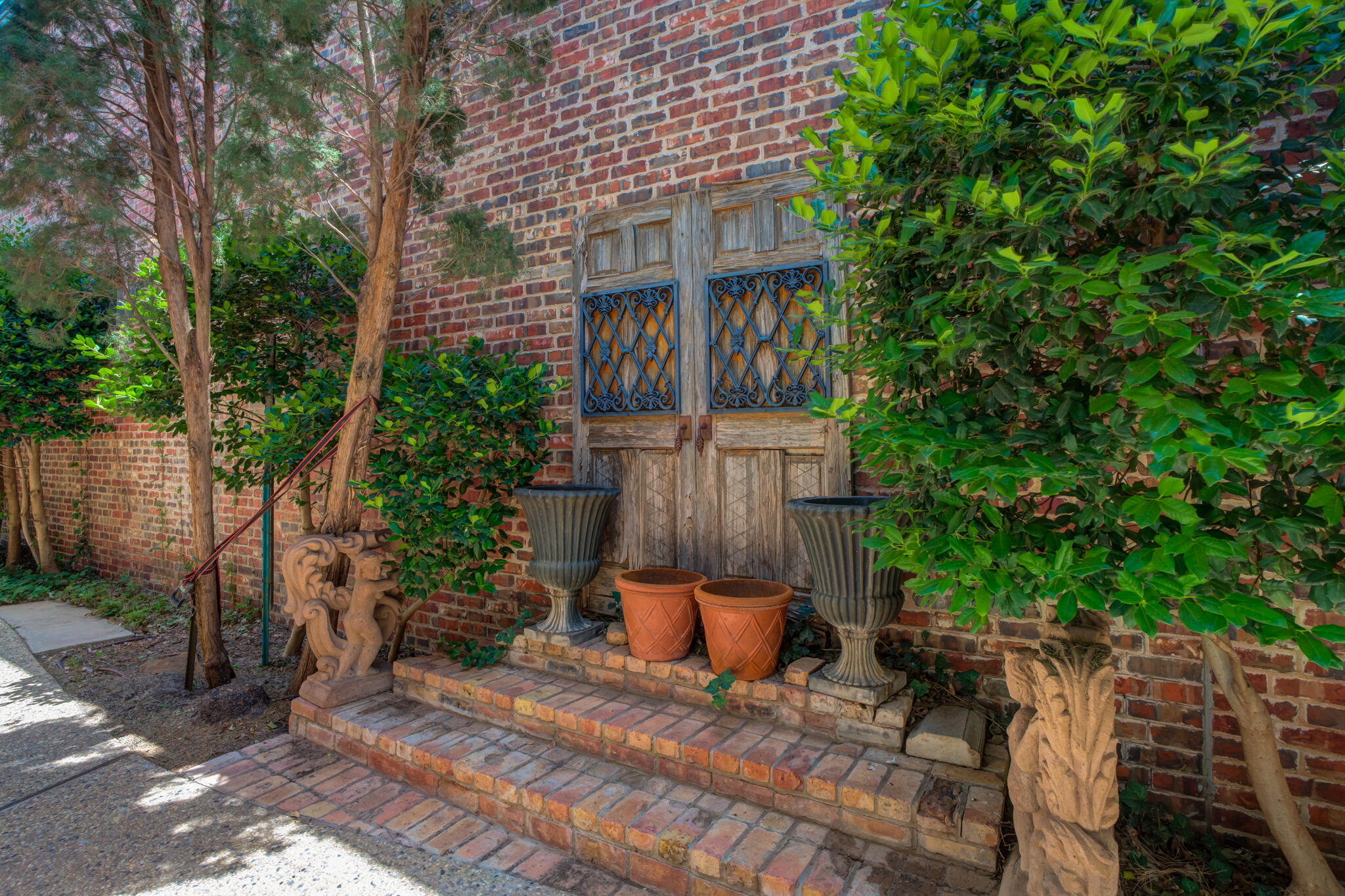 8901 York Place Lubbock, TX 79424 - Photo 45 of 45 a view of a brick house with plants and wooden fence