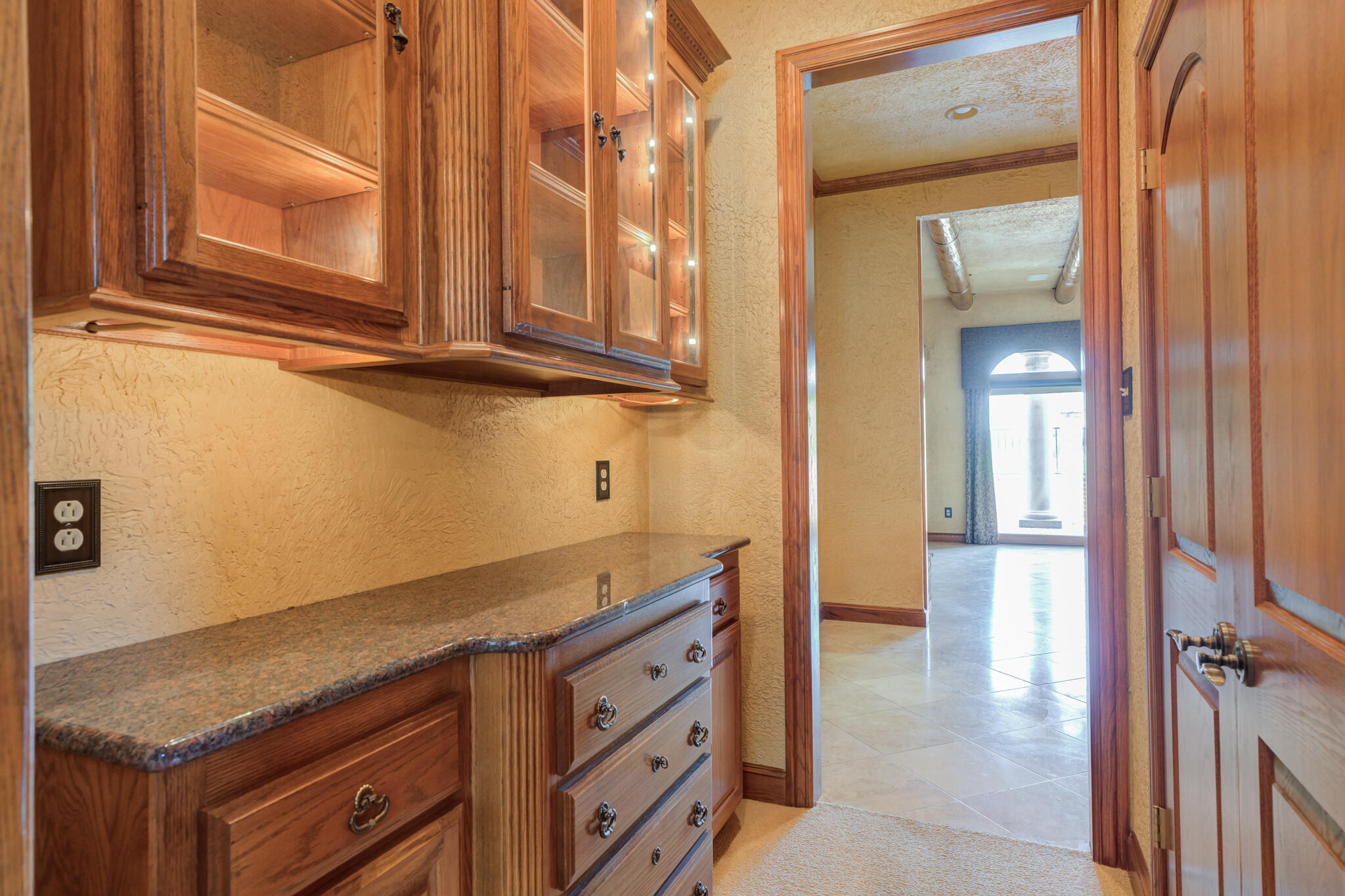 8901 York Place Lubbock, TX 79424 - Photo 7 of 45 a kitchen with granite countertop a sink and cabinets