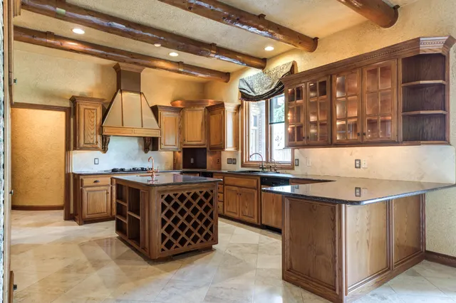 a kitchen with a stove a sink and a refrigerator