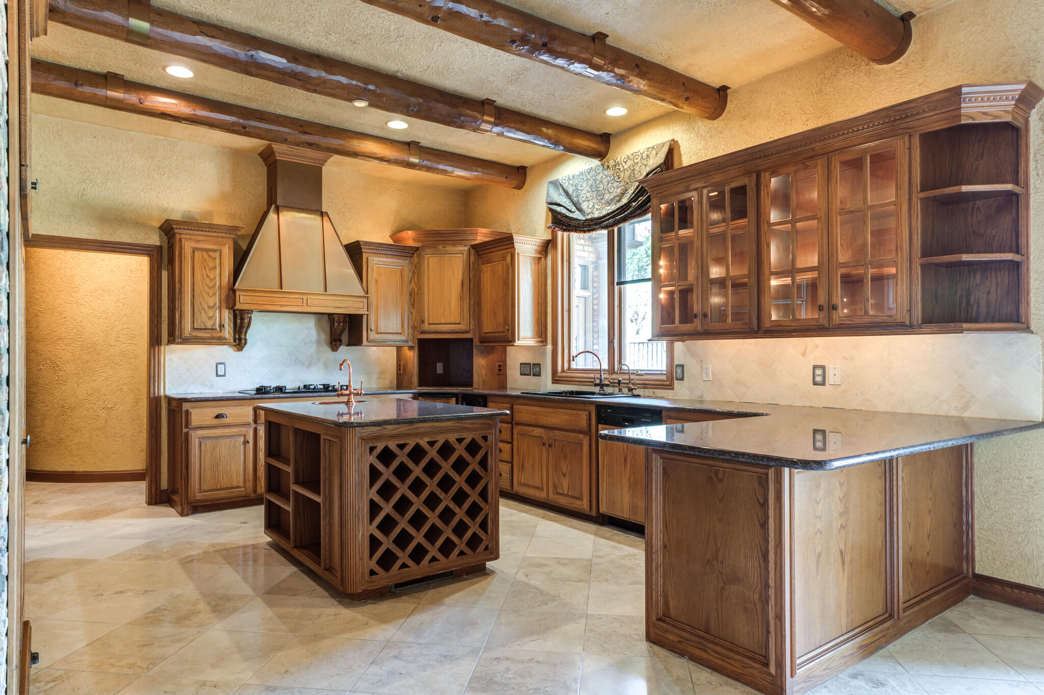 8901 York Place Lubbock, TX 79424 - Photo 9 of 45 a kitchen with a stove a sink and a refrigerator