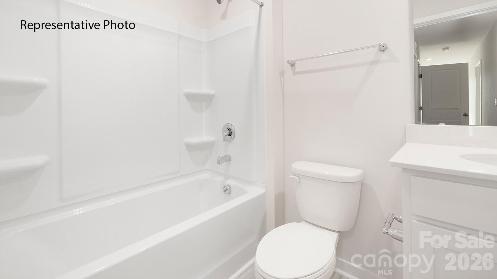1018 Two Brothers Lane York, SC 29745 - Photo 18 of 21 a white toilet sitting next to a bath tub