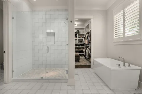 a bedroom with a bed a desk and chair