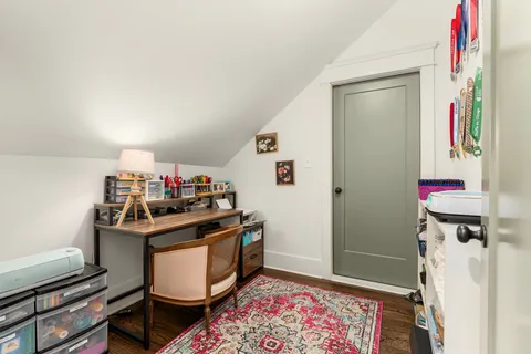 a front view of a house with garden and porch