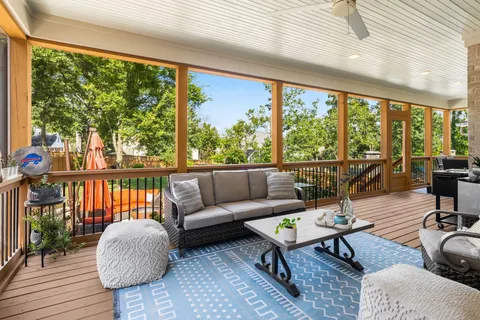 a front view of a house with a garden and sitting area