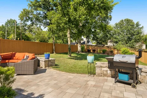 a outdoor living space with furniture and a potted plant