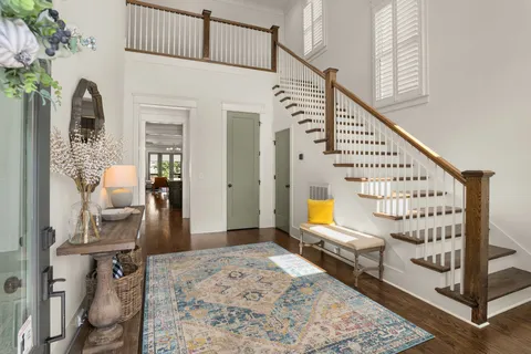 a kitchen with granite countertop a sink counter top space and living room view