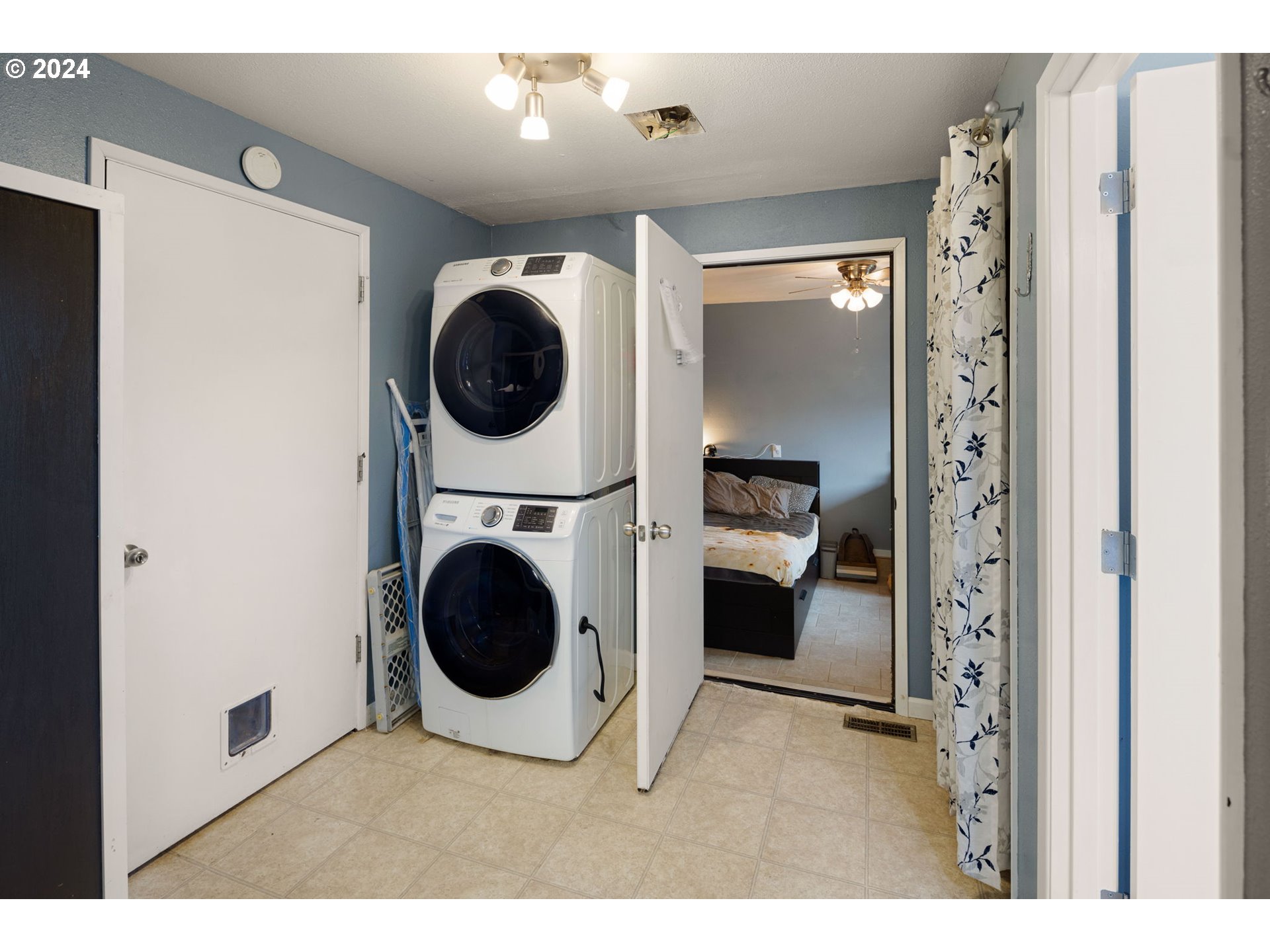 6926 B Street Springfield, OR 97478 - Photo 13 of 29 a view of a hallway with washer and dryer