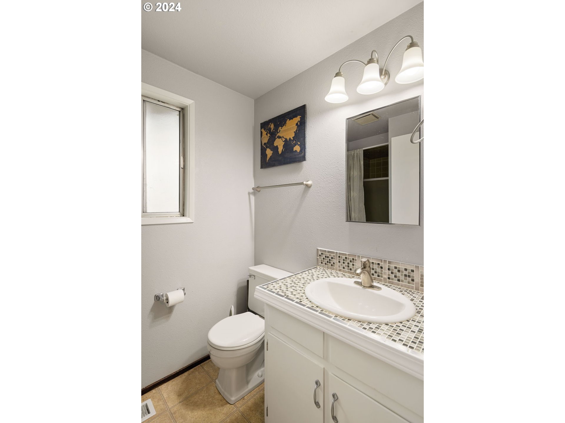 6926 B Street Springfield, OR 97478 - Photo 14 of 29 a bathroom with a granite countertop sink and a mirror