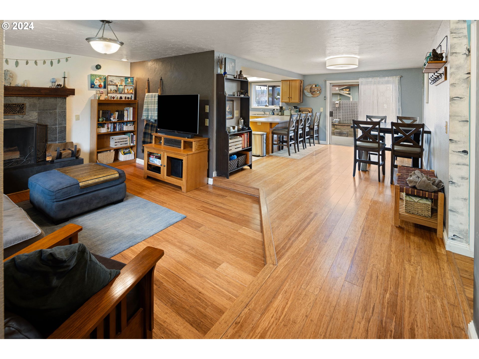 6926 B Street Springfield, OR 97478 - Photo 3 of 29 a living room with furniture and a flat screen tv