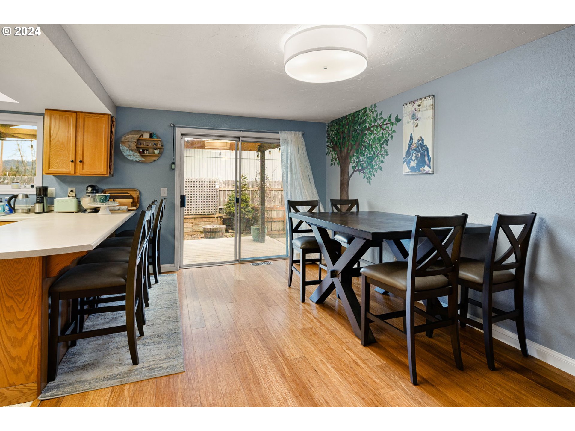 6926 B Street Springfield, OR 97478 - Photo 7 of 29 a dining room with furniture and wooden floor