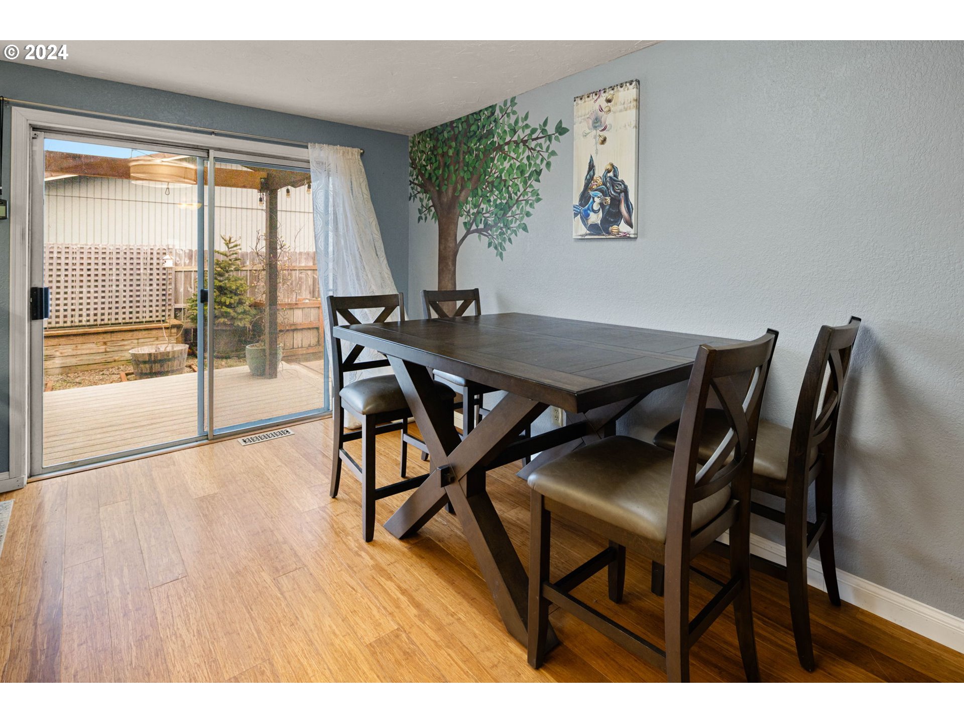 6926 B Street Springfield, OR 97478 - Photo 8 of 29 a view of a dining room with furniture and wooden floor