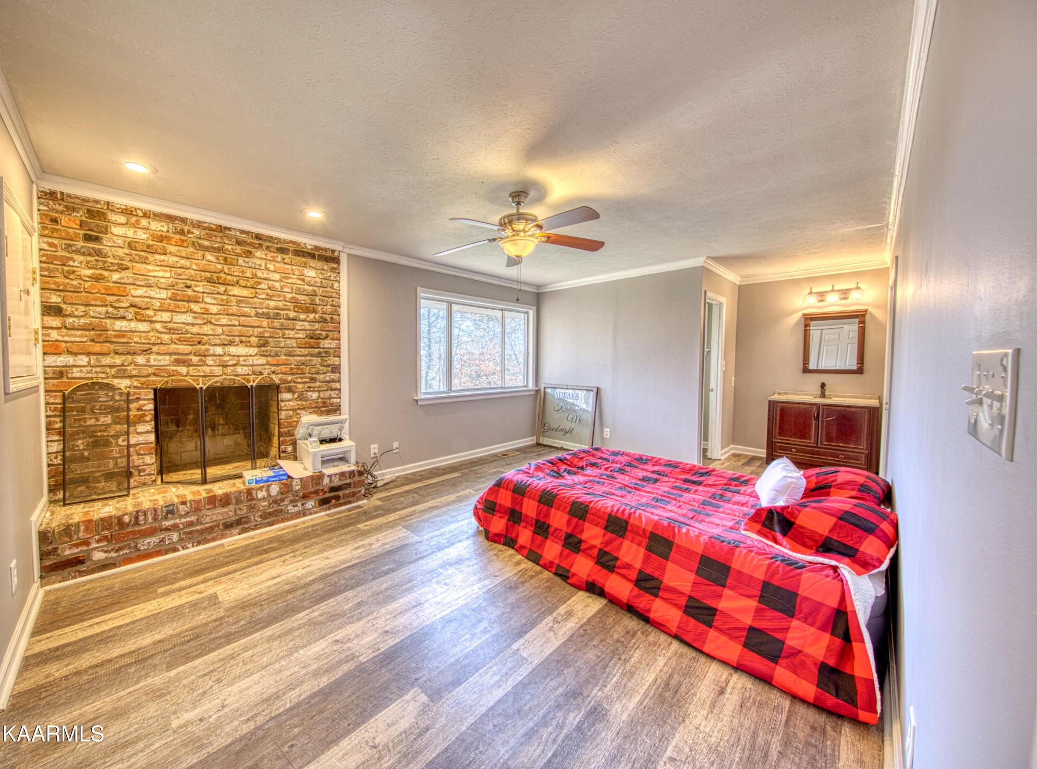 100 Windham Road Oak Ridge, TN 37830 - Photo 3 of 27 a bedroom with a bed and a fireplace