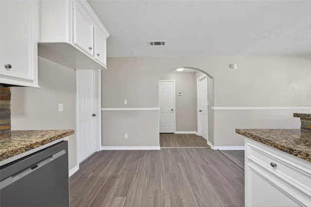 a kitchen with a sink and refrigerator