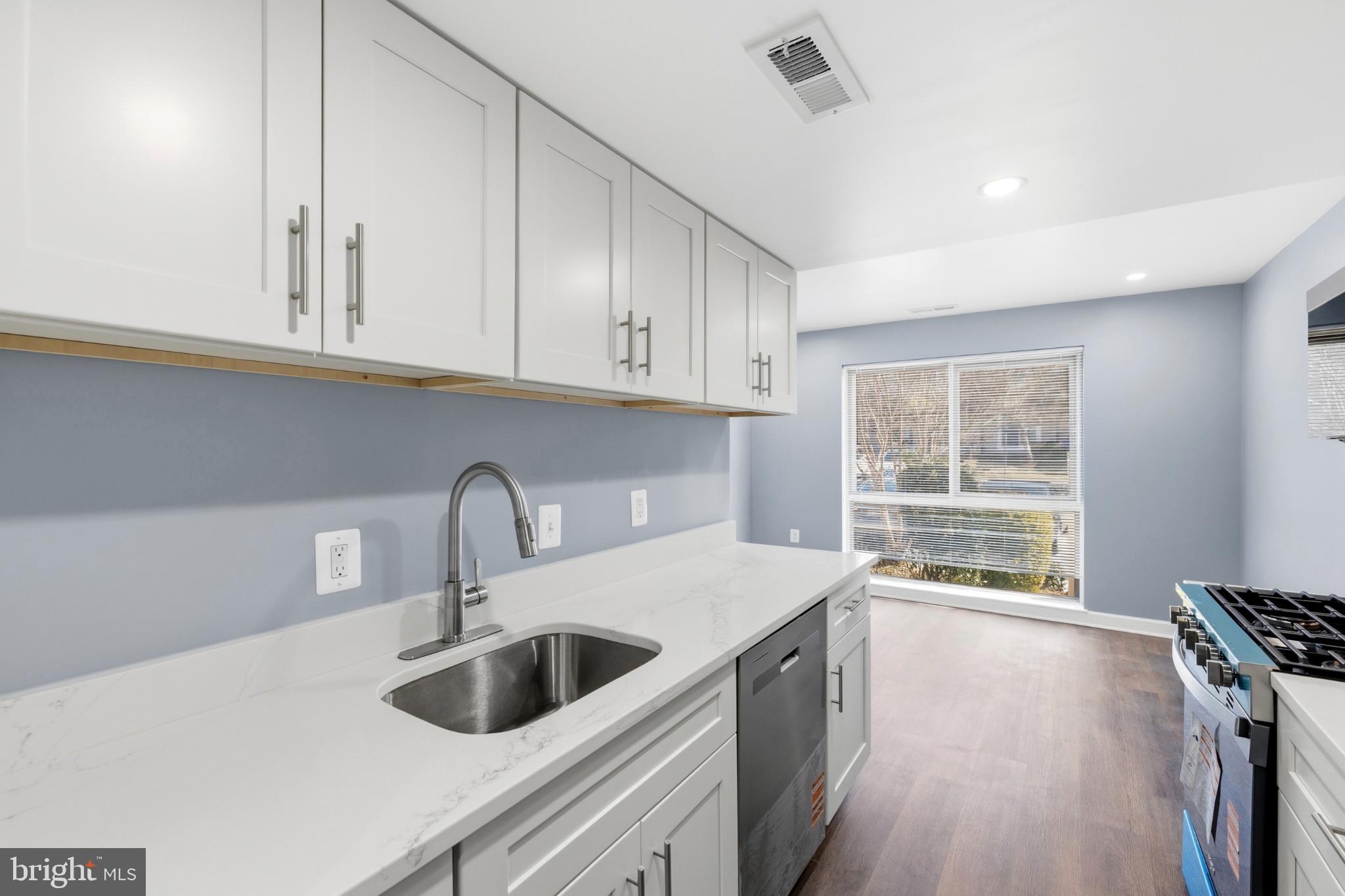 14400 Gunstock Court, Unit 4 Silver Spring, MD 20906 - Photo 15 of 47 Modern kitchen with sleek finishes.