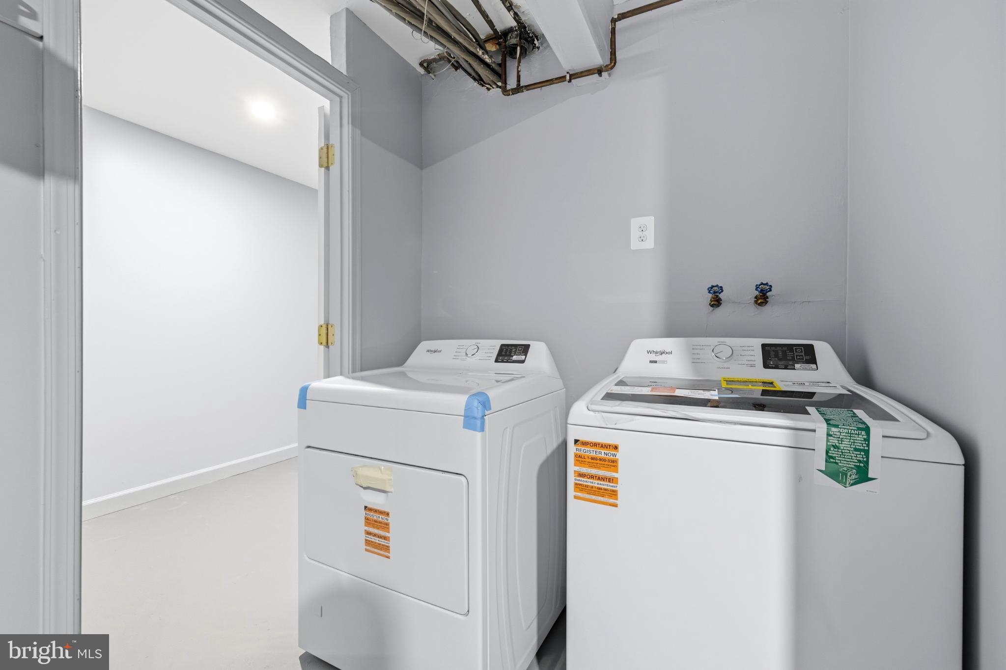 14400 Gunstock Court, Unit 4 Silver Spring, MD 20906 - Photo 23 of 47 Modern laundry space with sleek appliances.