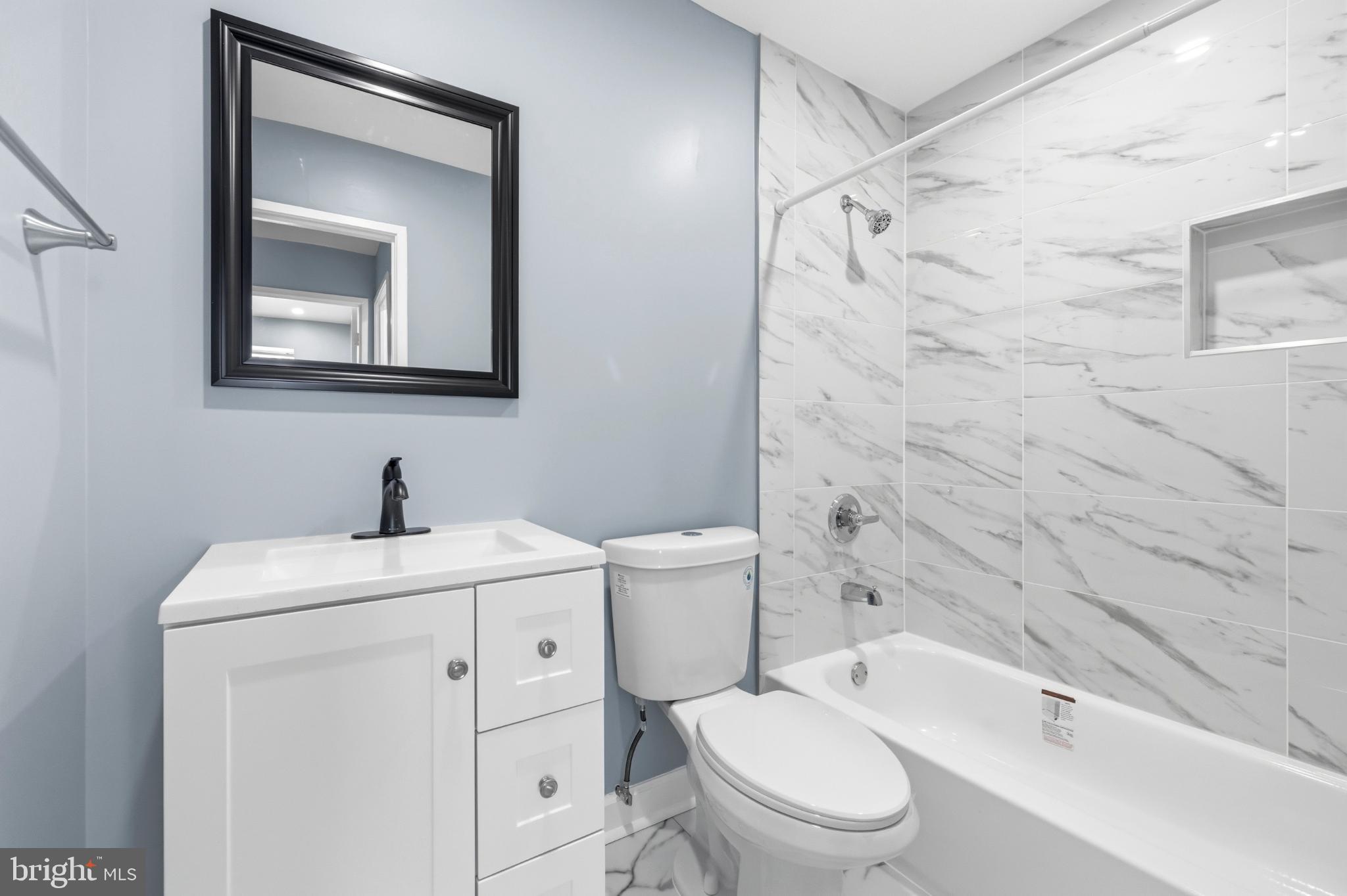 14400 Gunstock Court, Unit 4 Silver Spring, MD 20906 - Photo 35 of 47 Modern bathroom with elegant marble accents.