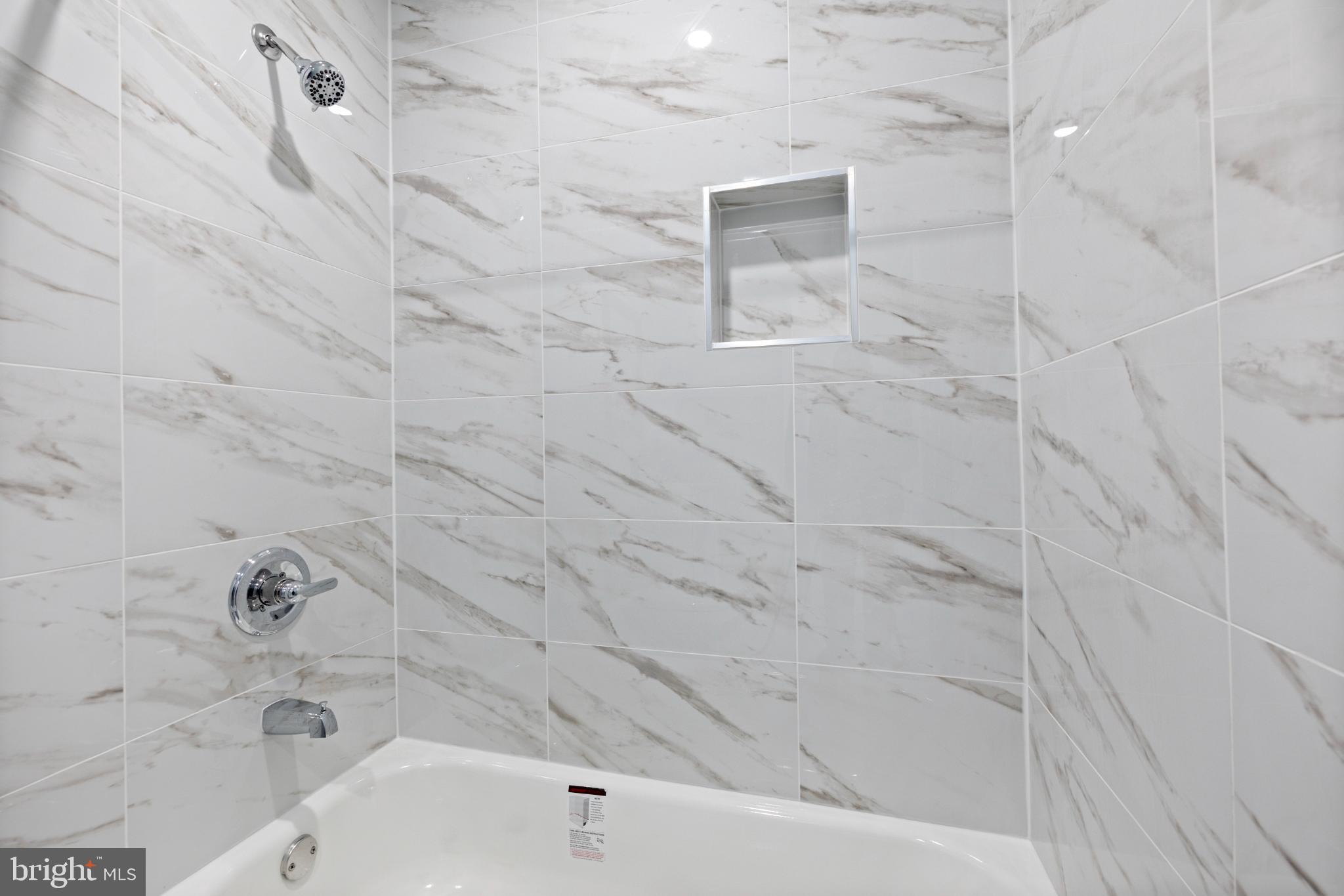 14400 Gunstock Court, Unit 4 Silver Spring, MD 20906 - Photo 36 of 47 Elegant marble-inspired shower retreat.