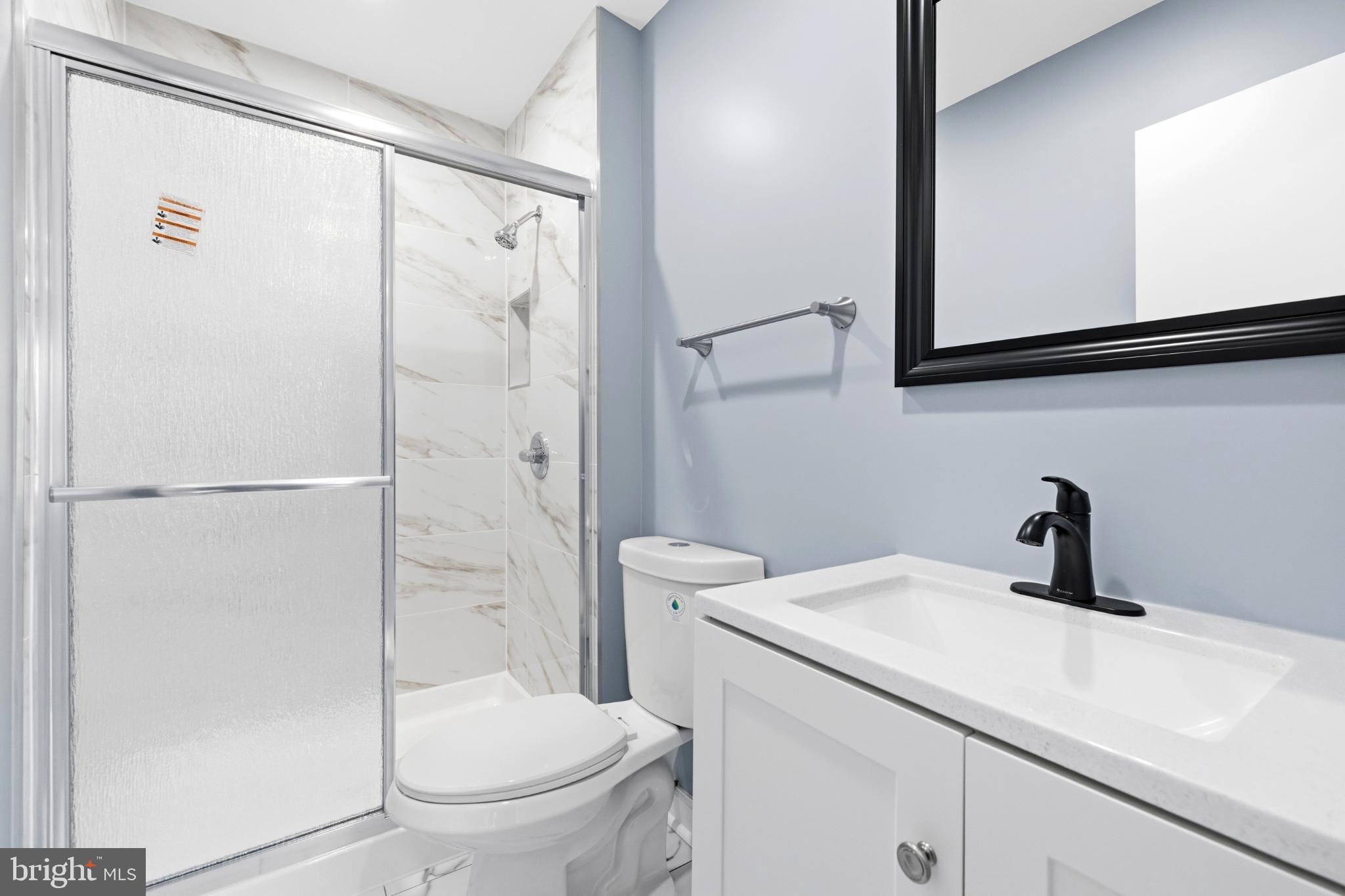 14400 Gunstock Court, Unit 4 Silver Spring, MD 20906 - Photo 41 of 47 Sleek modern bathroom with elegant finishes.
