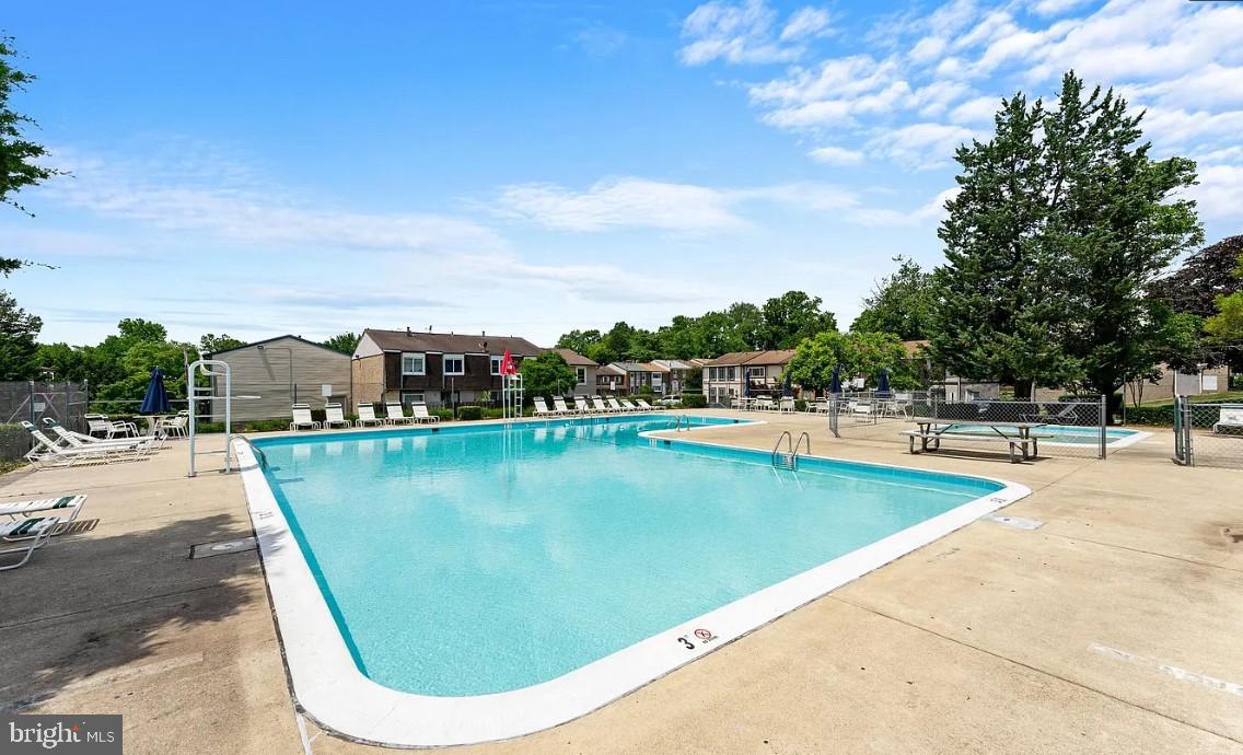 14400 Gunstock Court, Unit 4 Silver Spring, MD 20906 - Photo 46 of 47 Refreshing oasis with inviting poolside charm.