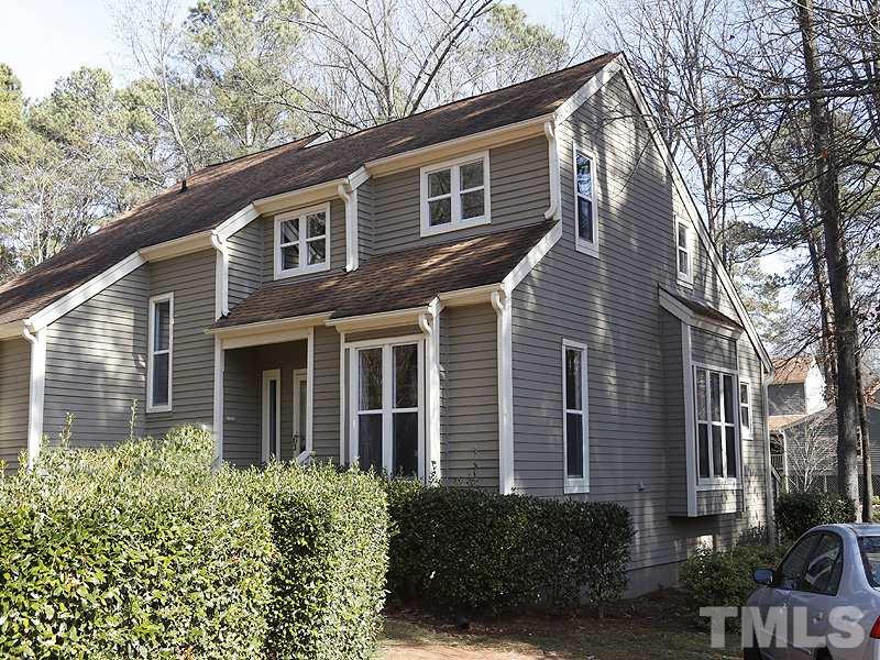 5919 Sentinel Drive Raleigh, NC 27609 - Photo 1 of 13 a front view of a house with garden