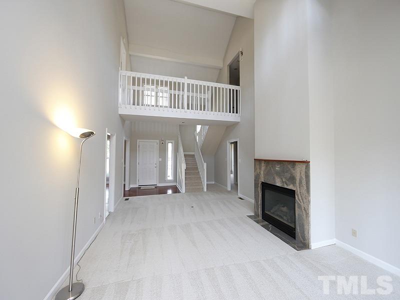 5919 Sentinel Drive Raleigh, NC 27609 - Photo 2 of 13 a view of a livingroom with a fireplace and a window