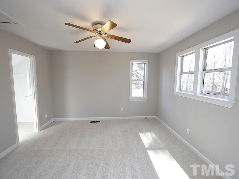 5919 Sentinel Drive Raleigh, NC 27609 - Photo 10 of 13 a view of an empty room with a window