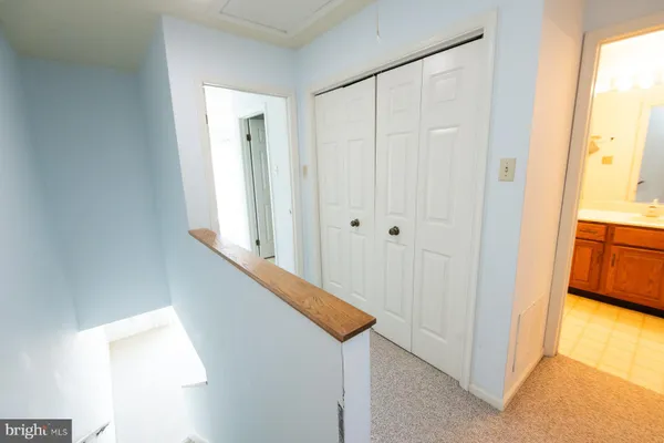 a view of a hallway with a dining room