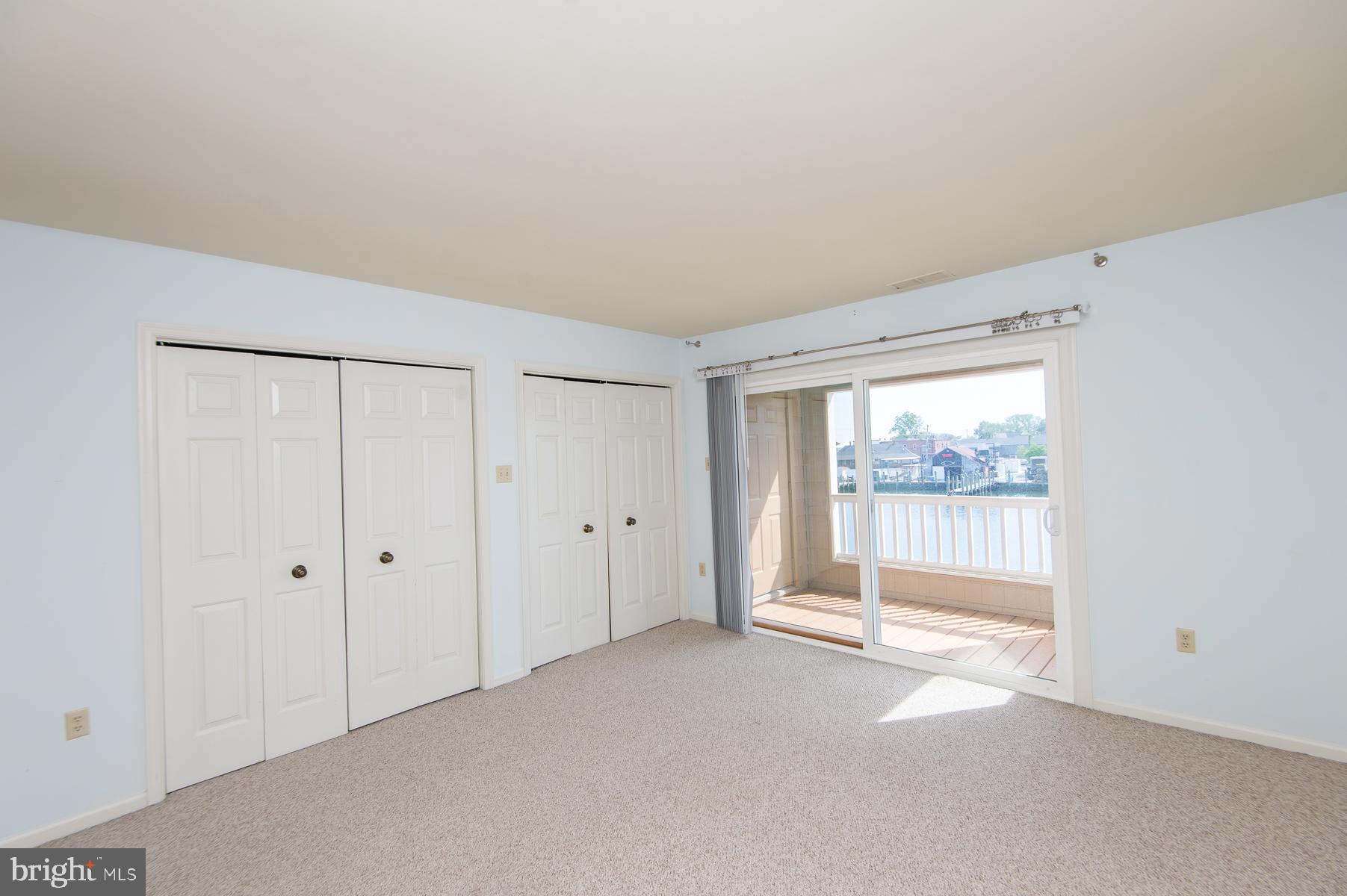 204 Market Square, Unit 12C Cambridge, MD 21613 - Photo 32 of 44 a view of an empty room with a window