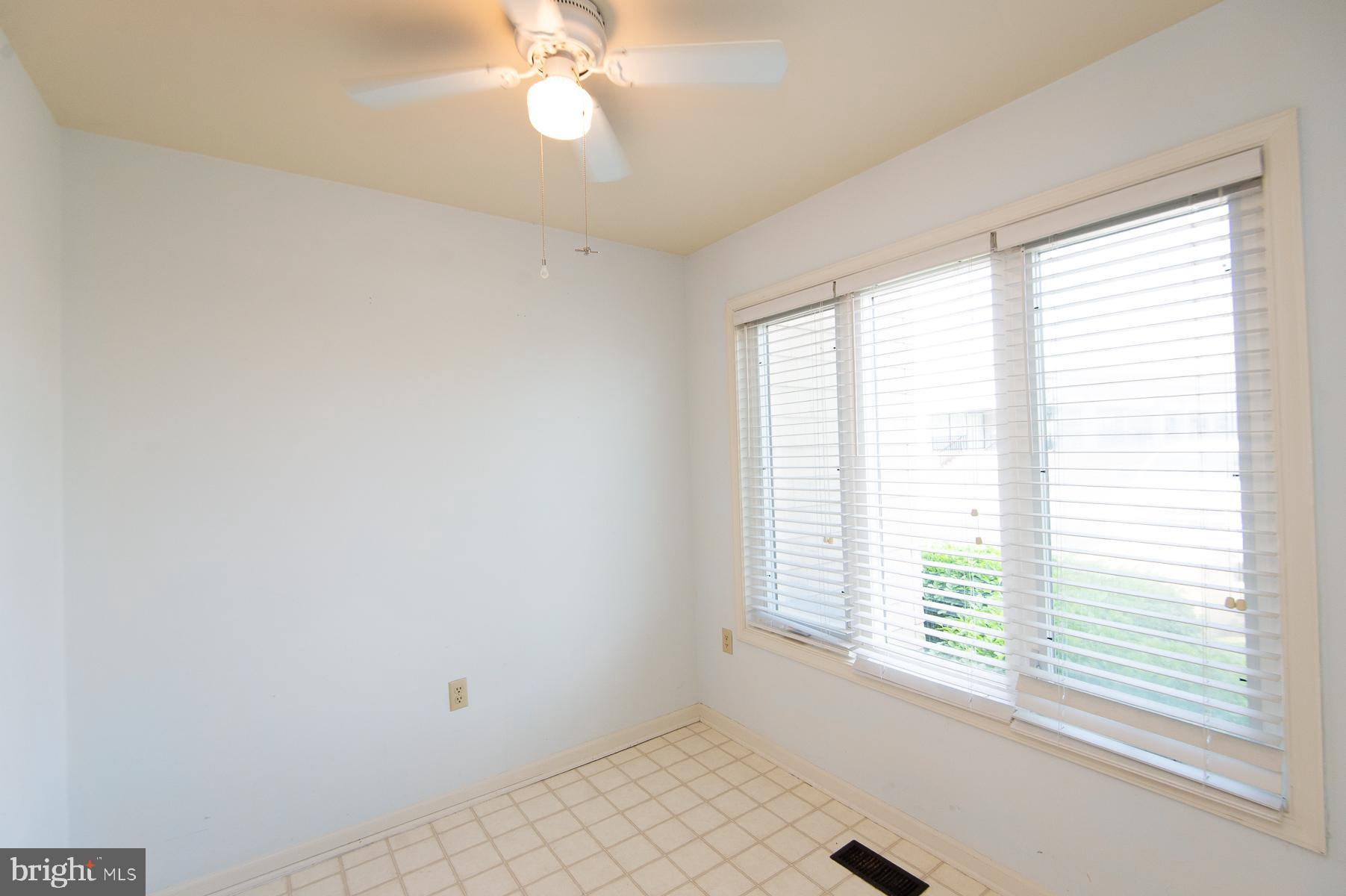 204 Market Square, Unit 12C Cambridge, MD 21613 - Photo 8 of 44 a view of an empty room with a window