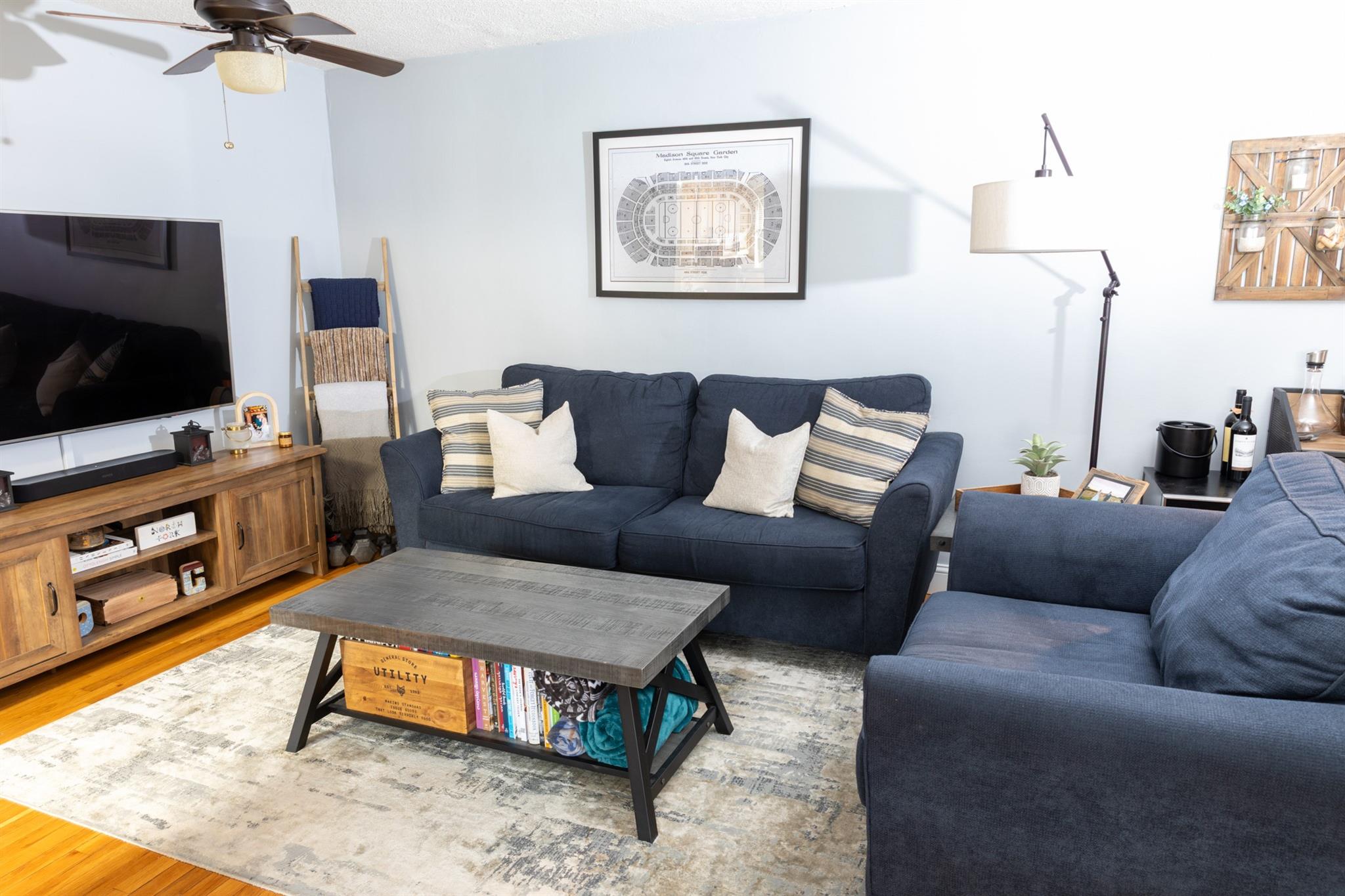 304 Fenimore Road, Unit 7A Mamaroneck, NY 10543 - Photo 3 of 10 a living room with furniture and a flat screen tv