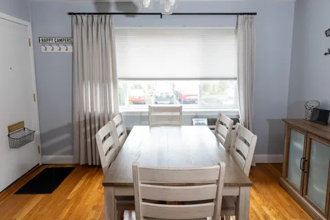 a view of a dining room with furniture window and outside view