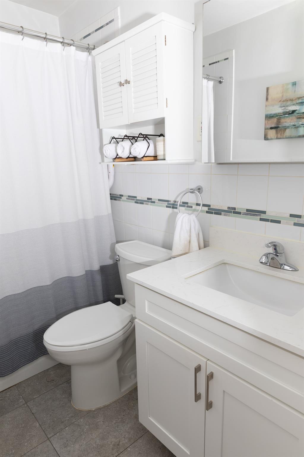 304 Fenimore Road, Unit 7A Mamaroneck, NY 10543 - Photo 6 of 10 a bathroom with a toilet and a shower